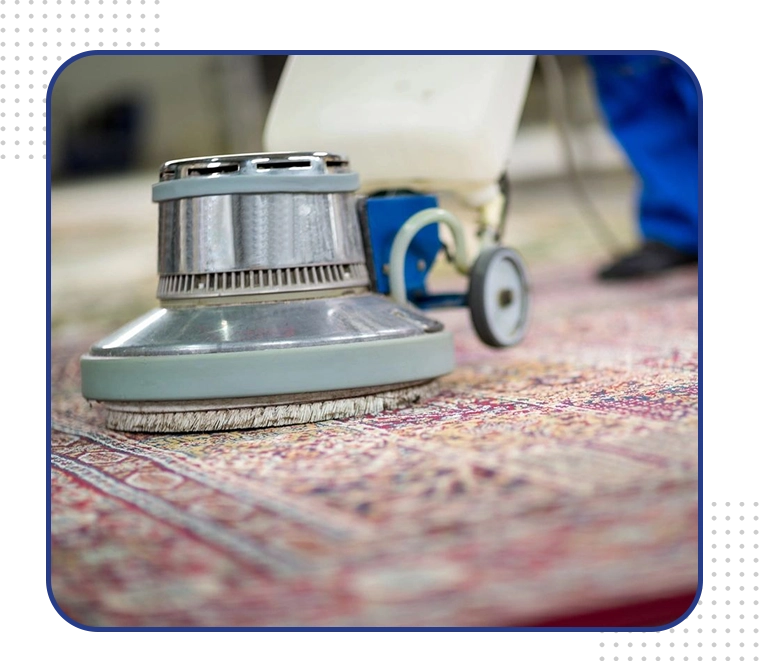 A carpet cleaner is cleaning the floor.